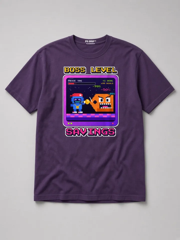 Mockup: Boss Level Savings on a grape heavyweight tee. 8-bit Tommy Bot takes on a pixel price-tag villain on a retro game screen.